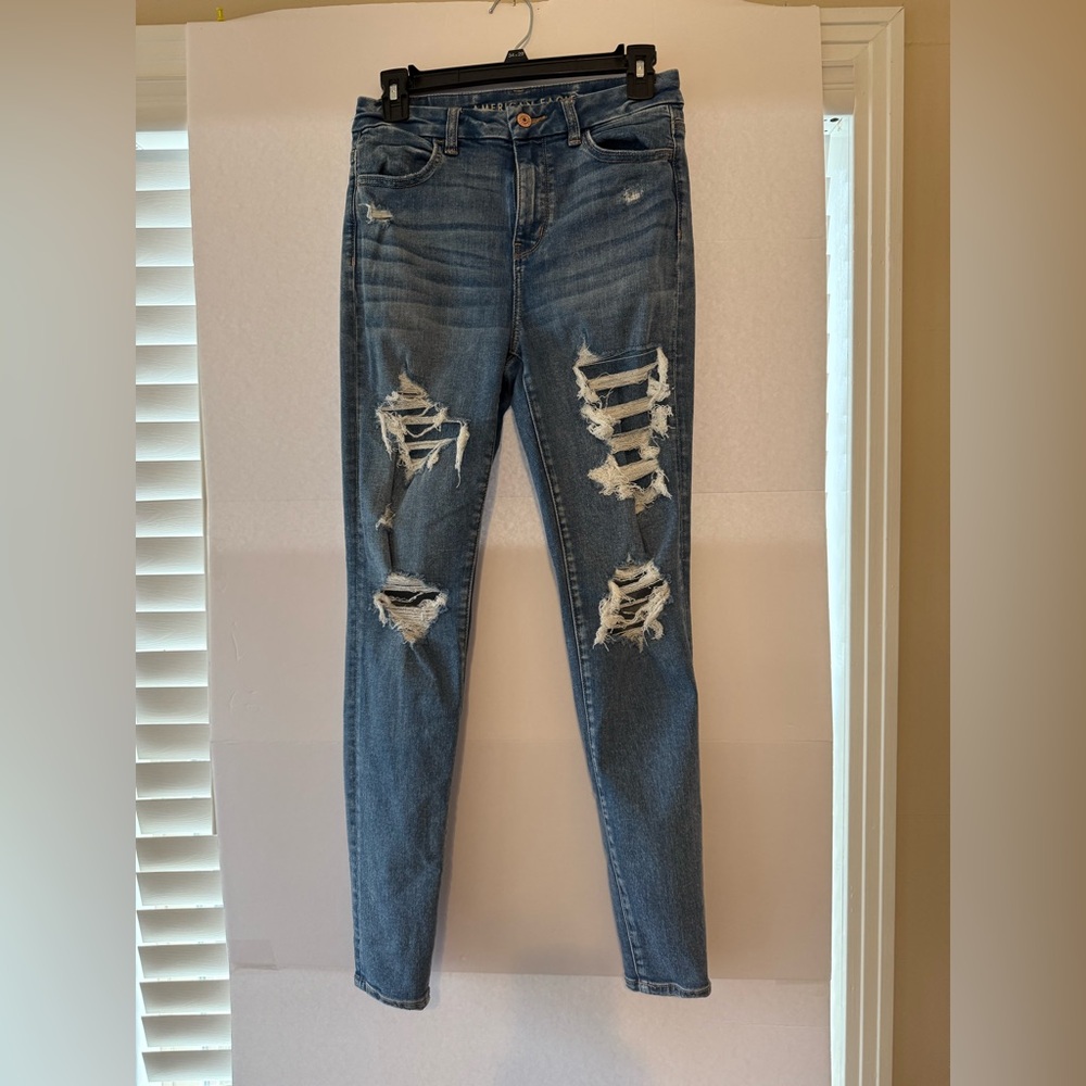 American Eagle Outfitters Ripped Blue Skinny Jeans size is 4